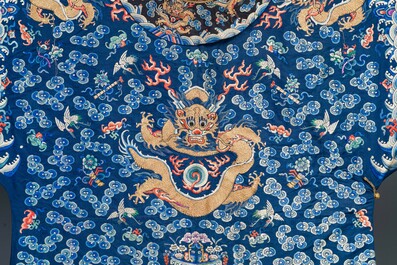 A Chinese gold thread embroidered blue-ground silk 'dragon' robe, 19th C.