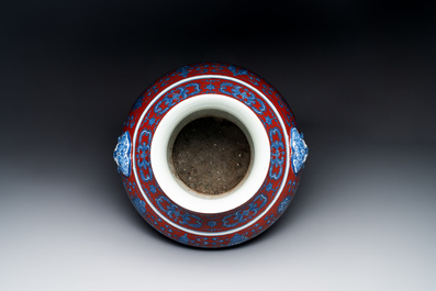 A Chinese blue, white and iron-red 'bajixiang' 'hu' vase on wooden stand, Qianlong mark, 19th C.