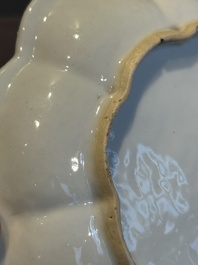 A Chinese famille rose teapot and stand with floral relief design, Qianlong