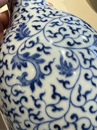 A Chinese blue and white 'lotus scroll' bottle vase, Yongzheng mark, 19/20th C.