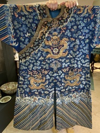 A Chinese gold thread embroidered blue-ground silk 'dragon' robe, 19th C.