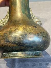 A small Chinese bronze bottle vase with lion-form handles, Qing, 17th C.
