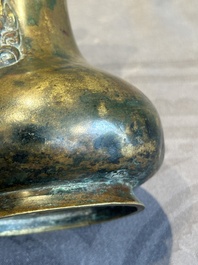 A small Chinese bronze bottle vase with lion-form handles, Qing, 17th C.