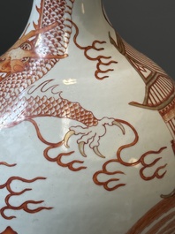 A Chinese iron-red gilt-decorated 'dragon and carp' bottle vase, 19/20th C.