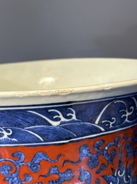 A Chinese blue, white and iron-red 'bajixiang' 'hu' vase on wooden stand, Qianlong mark, 19th C.