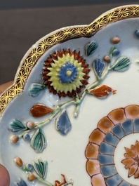 A Chinese famille rose teapot and stand with floral relief design, Qianlong