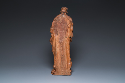A Flemish late gothic carved oak sculpture of Saint Thecla on a pyre, Brabant region, first half 16th C.