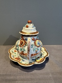 A Chinese famille rose teapot and stand with floral relief design, Qianlong