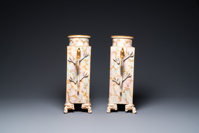 A pair of Japanese Satsuma 'Shimazu Mon' vases on elephant-form feet, Meiji, 19th C.