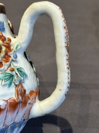 A Chinese famille rose teapot and stand with floral relief design, Qianlong