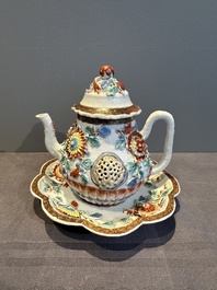 A Chinese famille rose teapot and stand with floral relief design, Qianlong