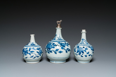 Three Japanese blue and white Arita 'birds among flowering branches' pharmacy bottles, Edo, 18th C.