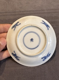 Two Chinese blue and white cups and three saucers with figural design, Kangxi and later
