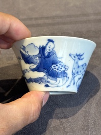 Two Chinese blue and white cups and three saucers with figural design, Kangxi and later