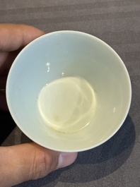 Two Chinese blue and white cups and three saucers with figural design, Kangxi and later