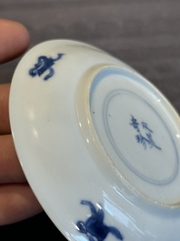 Two Chinese blue and white cups and three saucers with figural design, Kangxi and later