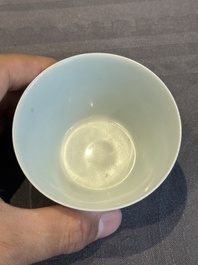 Two Chinese blue and white cups and three saucers with figural design, Kangxi and later