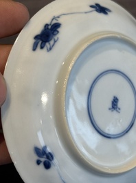 Two Chinese blue and white cups and three saucers with figural design, Kangxi and later