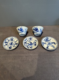 Two Chinese blue and white cups and three saucers with figural design, Kangxi and later