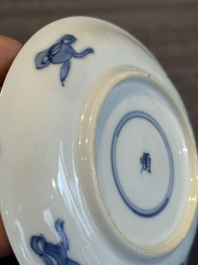 Two Chinese blue and white cups and three saucers with figural design, Kangxi and later