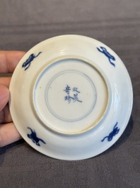 Two Chinese blue and white cups and three saucers with figural design, Kangxi and later