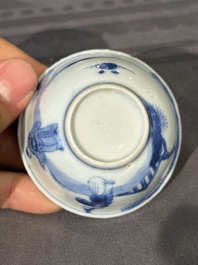 15 Chinese blue and white saucers and 13 cups with figural design, Kangxi/Yongzheng