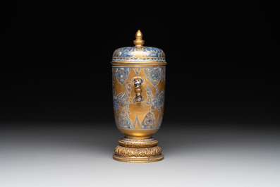A Chinese gilt-ground blue and white lidded beaker on a French gilt bronze foot, Kangxi