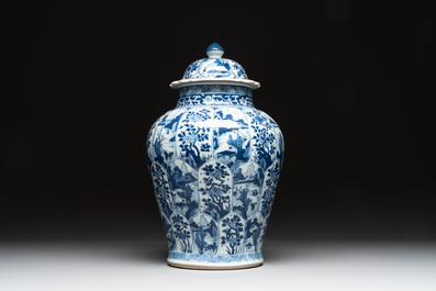 A Chinese blue and white vase and cover with landscapes and flowers, Kangxi