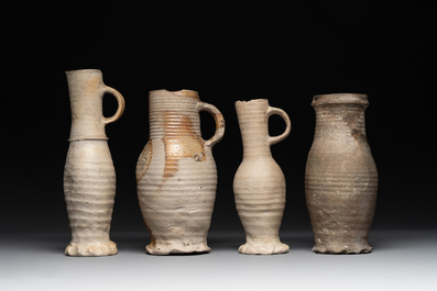 A collection of 8 German proto stoneware ribbed jugs, including 'Jacobakans', 14th C.