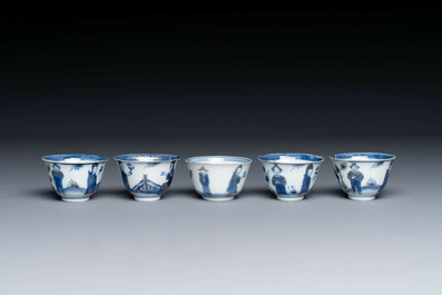 15 Chinese blue and white saucers and 13 cups with figural design, Kangxi/Yongzheng