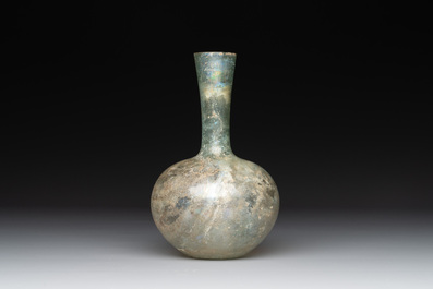 A Roman glass bottle with a conical neck, 4/5th C.