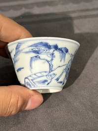 15 Chinese blue and white saucers and 13 cups with figural design, Kangxi/Yongzheng