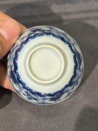 15 Chinese blue and white saucers and 13 cups with figural design, Kangxi/Yongzheng