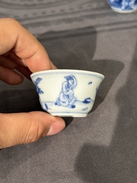 15 Chinese blue and white saucers and 13 cups with figural design, Kangxi/Yongzheng