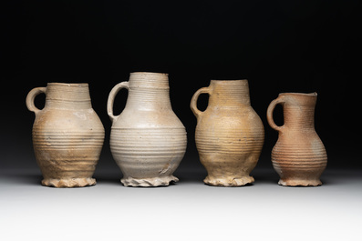 A collection of 8 German proto stoneware ribbed jugs, including 'Jacobakans', 14th C.