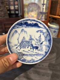 15 Chinese blue and white saucers and 13 cups with figural design, Kangxi/Yongzheng