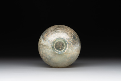 A Roman glass bottle with a conical neck, 4/5th C.