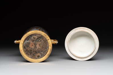 A Chinese gilt-ground blue and white lidded beaker on a French gilt bronze foot, Kangxi