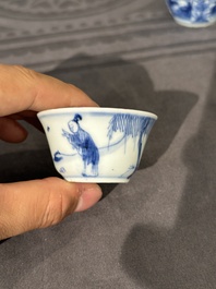 15 Chinese blue and white saucers and 13 cups with figural design, Kangxi/Yongzheng