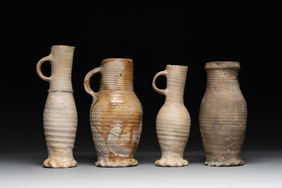 A collection of 8 German proto stoneware ribbed jugs, including 'Jacobakans', 14th C.