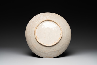 A Vietnamese or Annamese relief-molded blue, white and orange 'dragon' dish, 19th C.