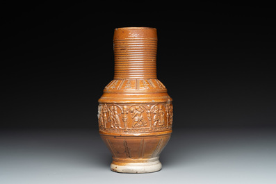 A Raeren stoneware 'peasant dance' jug, late 16th C.
