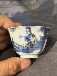 15 Chinese blue and white saucers and 13 cups with figural design, Kangxi/Yongzheng