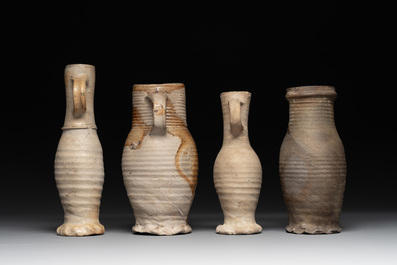 A collection of 8 German proto stoneware ribbed jugs, including 'Jacobakans', 14th C.