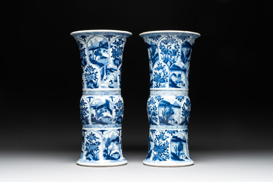 Two Chinese blue and white 'gu' vases with landscape and floral panels, Kangxi