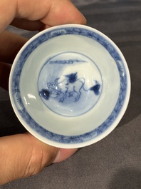 15 Chinese blue and white saucers and 13 cups with figural design, Kangxi/Yongzheng