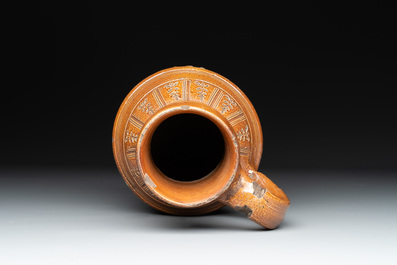 A Raeren stoneware 'peasant dance' jug, late 16th C.