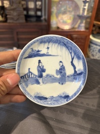 15 Chinese blue and white saucers and 13 cups with figural design, Kangxi/Yongzheng