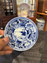 15 Chinese blue and white saucers and 13 cups with figural design, Kangxi/Yongzheng