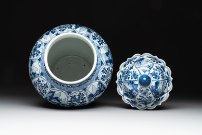 A Chinese blue and white vase and cover with landscapes and flowers, Kangxi